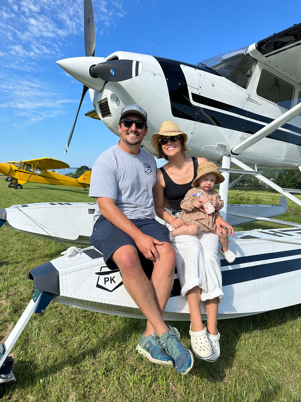 The Hartz family on the float of their airplane
