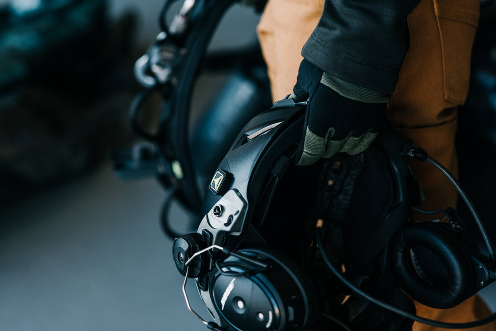Pilot holding a Bose A20 aviation headset