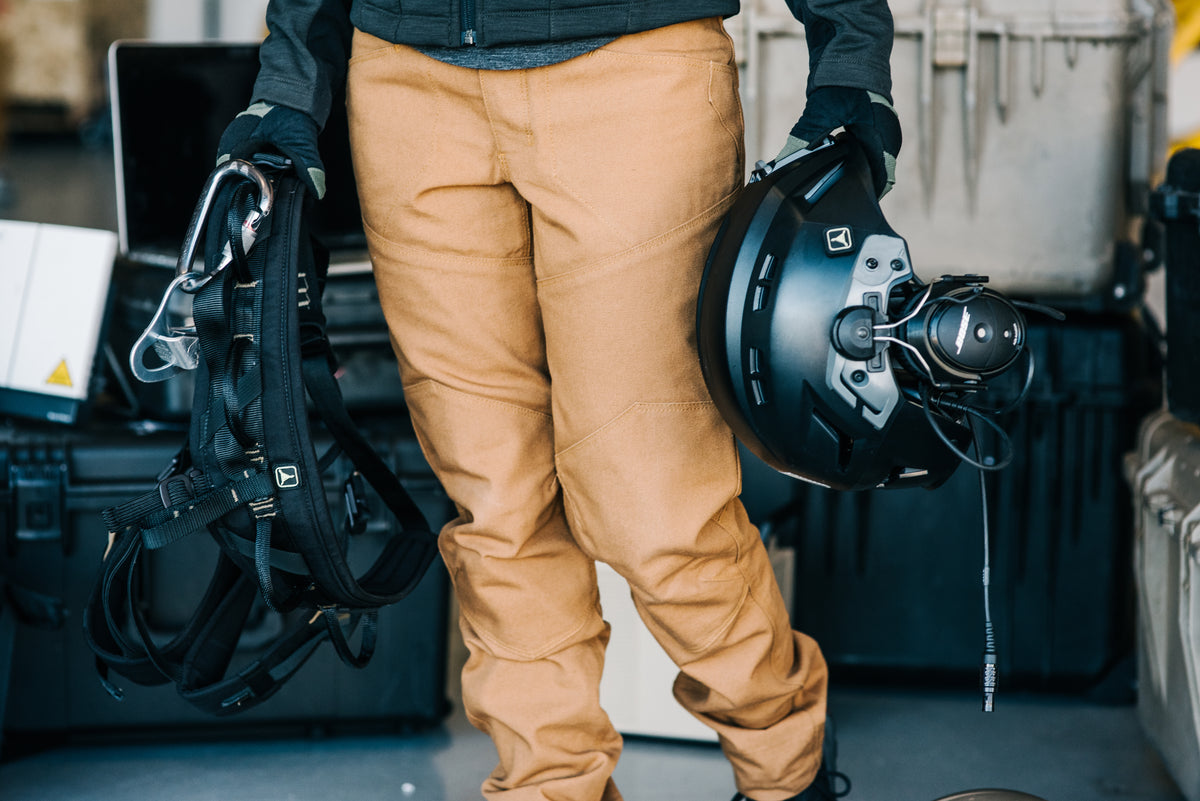 Pilot carrying a Bose A20 aviation headset out to the aircraft